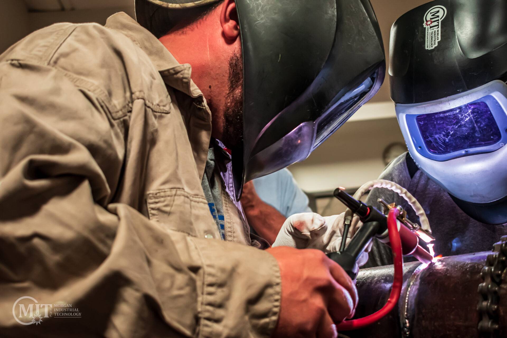 welder welding carbon steel pipe