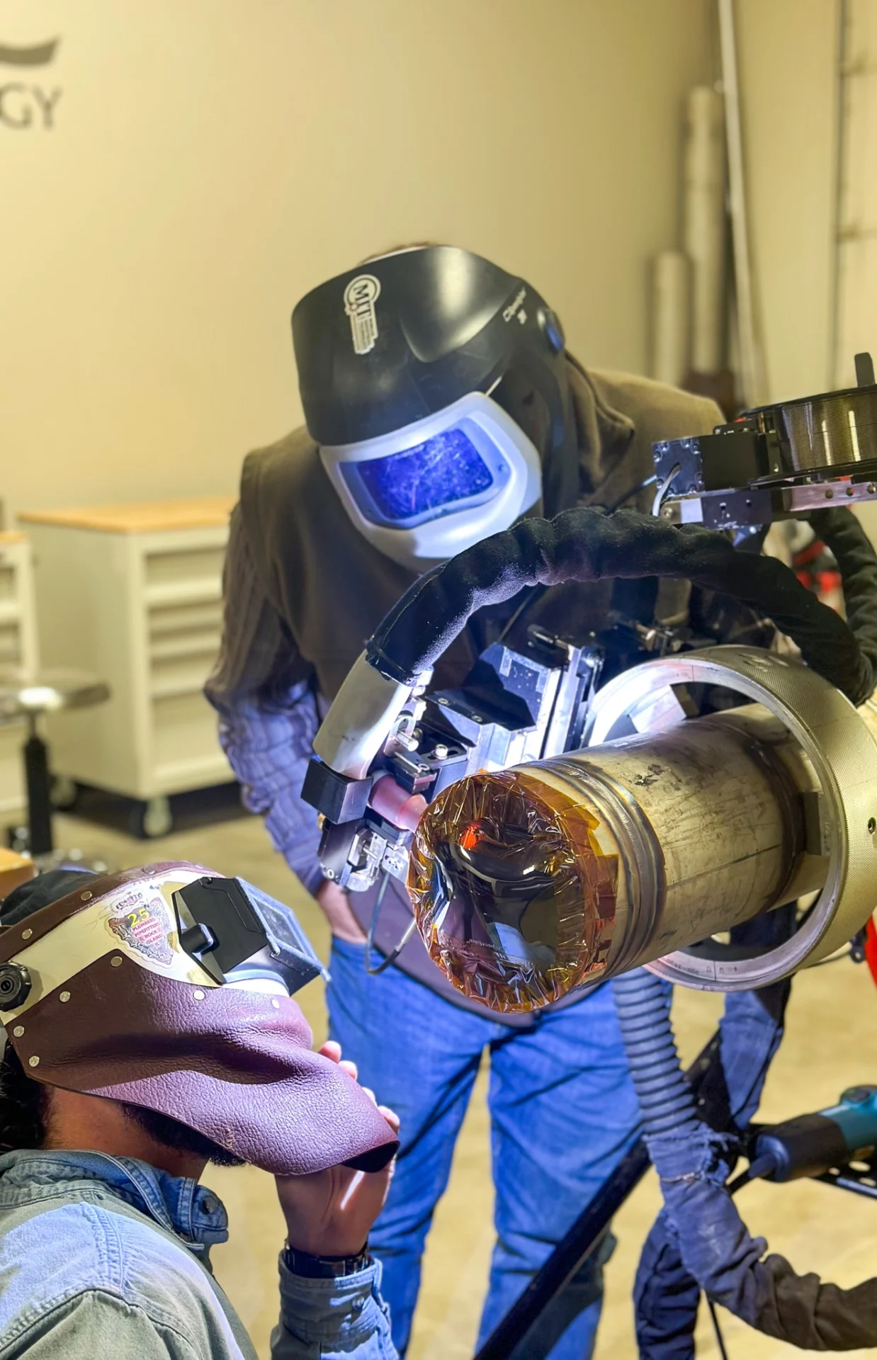 Welders examining the Liburdi Diametrics F-Head